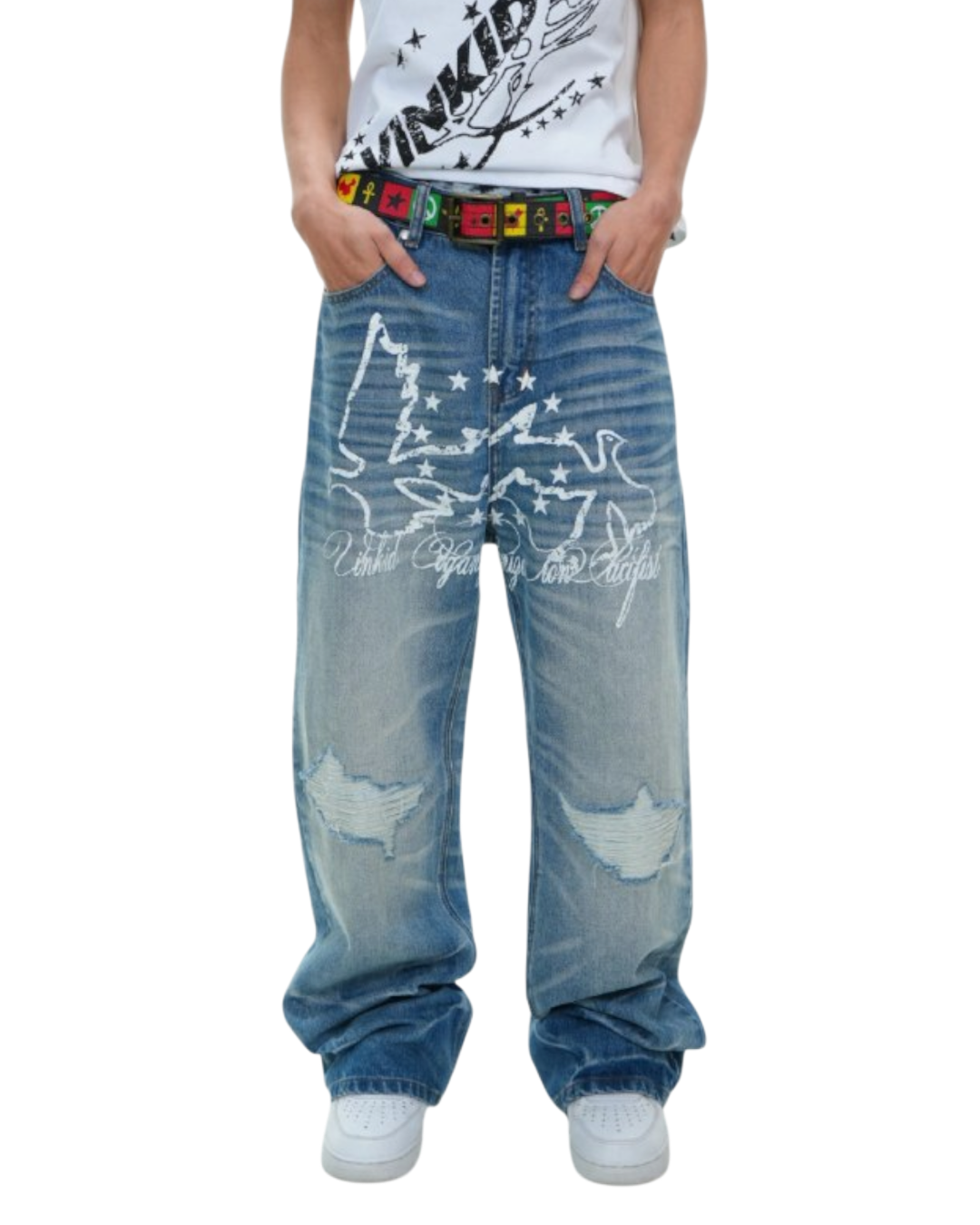 Blue jeans with white graphics and text worn by a person on a white background