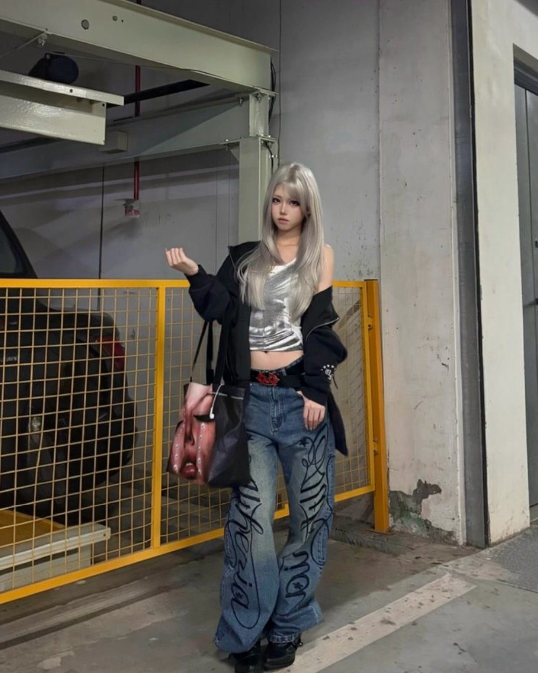Baggy denim jeans in blue with bold black script pattern and wide legs