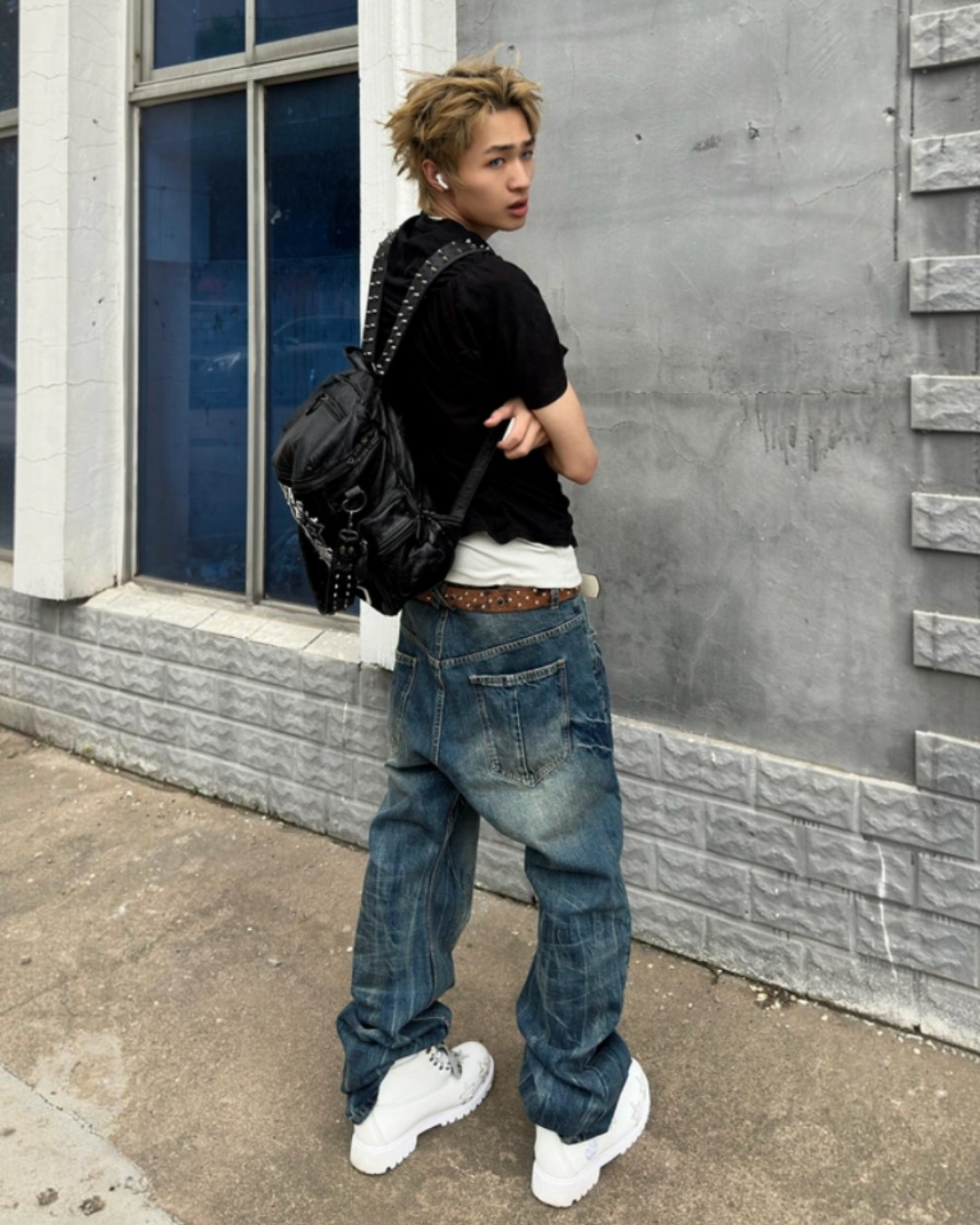 Blue washed flared denim jeans with back patch pockets, relaxed fit, wide leg