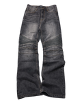 Pair of dark blue jeans with visible wear and tear on a white background