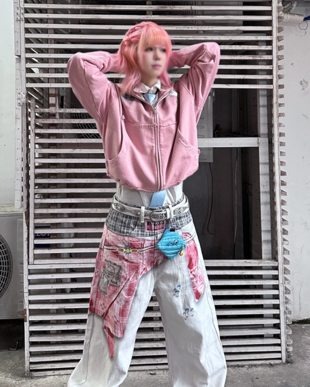 Washed zip hoodie in dusty pink, hood and full zipper, worn with patchwork pants