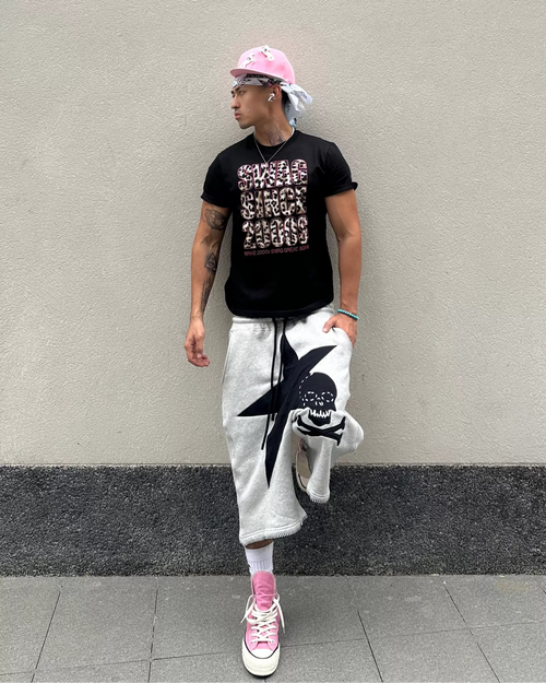 Light gray sweat shorts with black star-and-skull graphic and drawstring waist