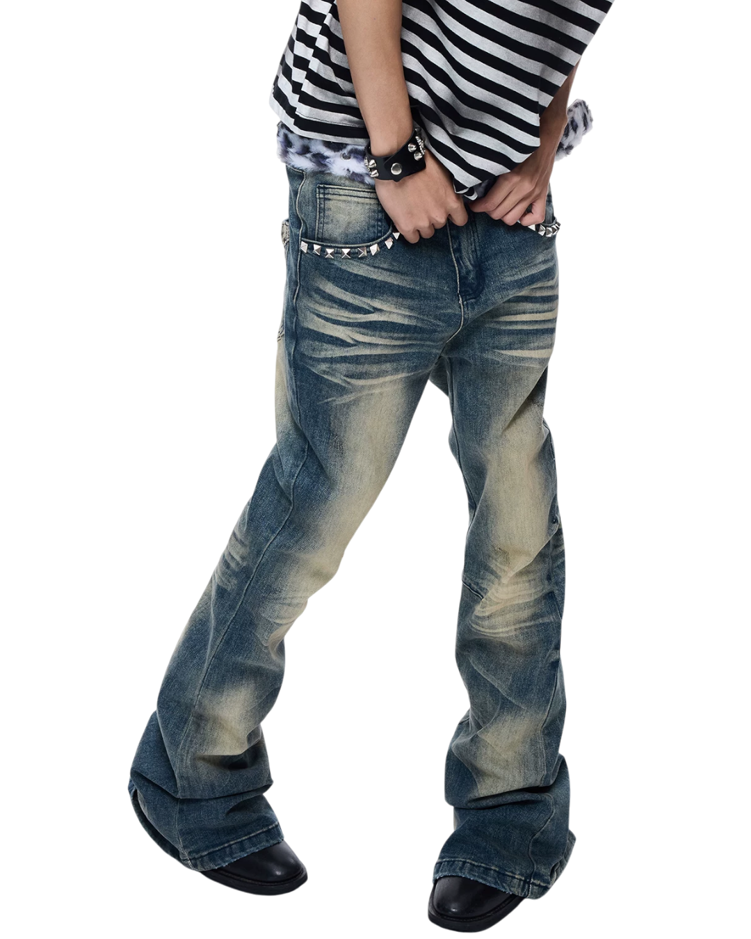 Dark blue skinny jeans with light wash streaks, studded pockets, and tapered legs