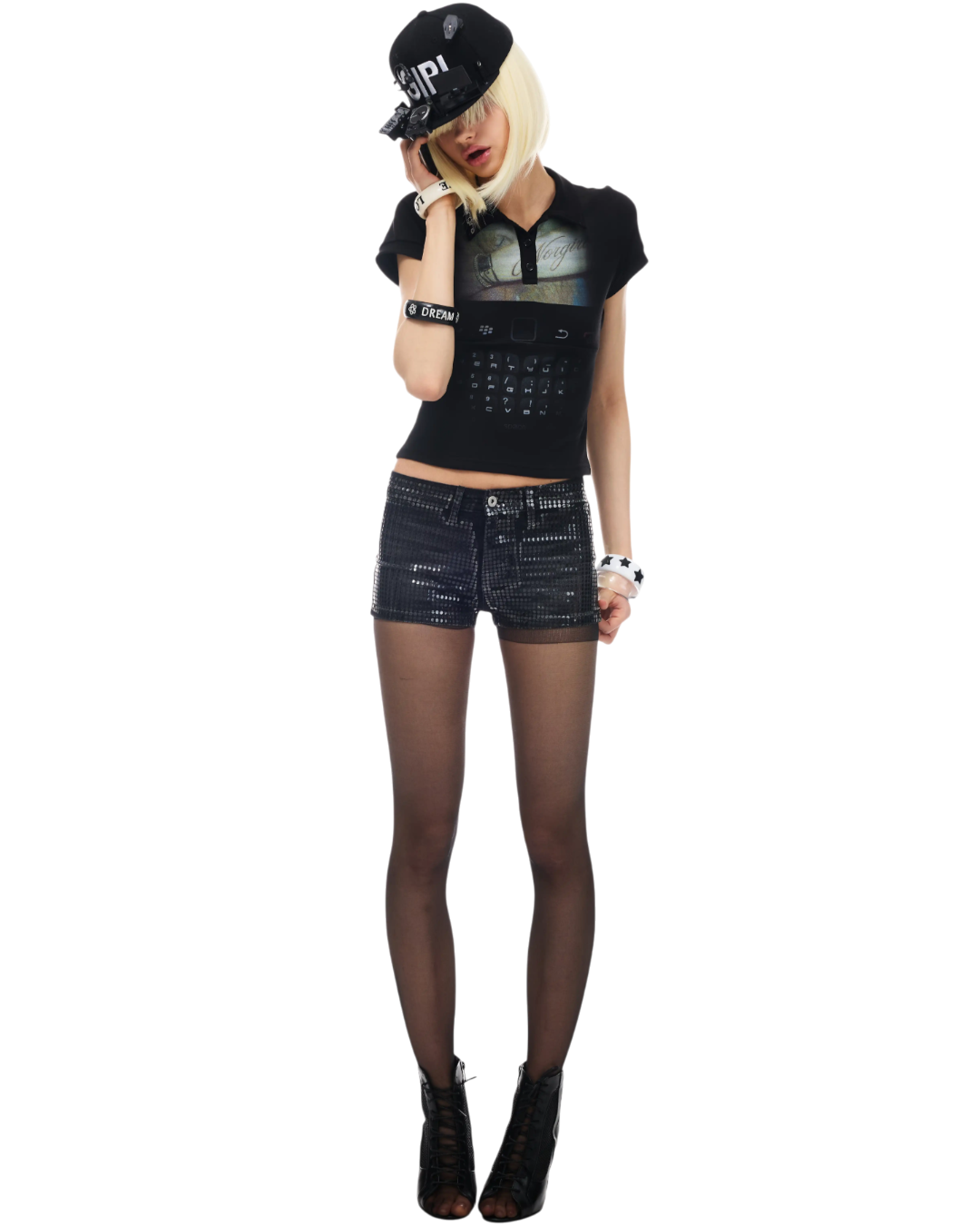 Person wearing a black outfit with a cap on a white background