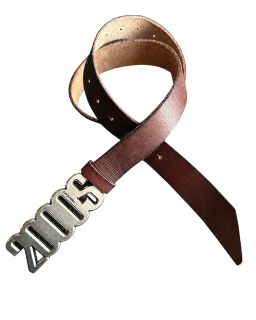 Brown leather belt close-up with silver buckle featuring raised lettering