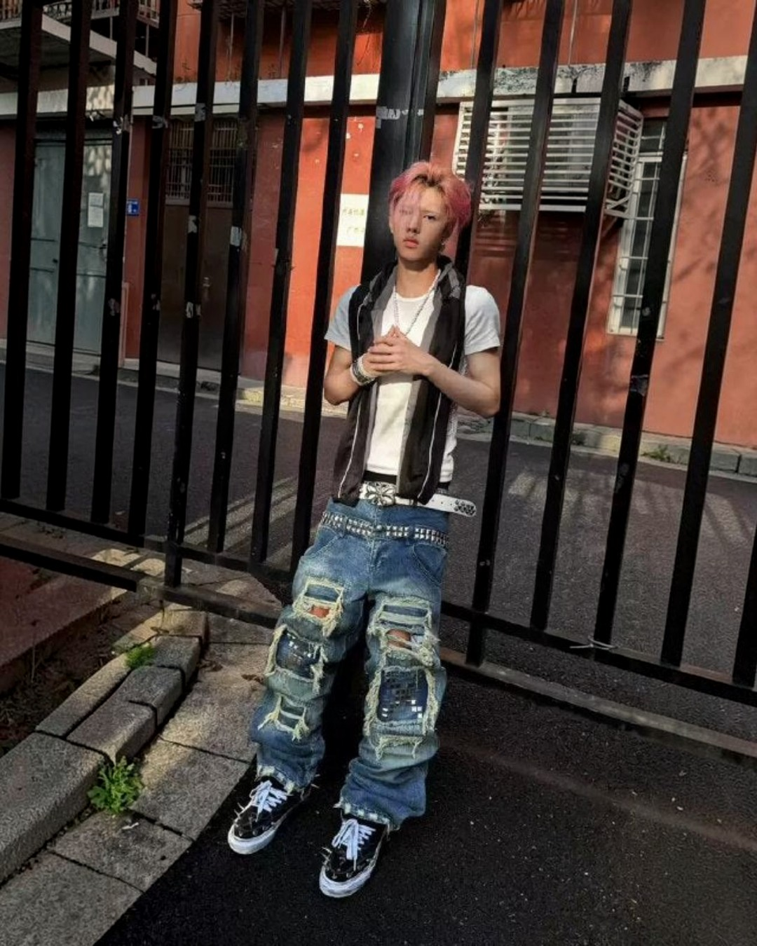 Blue punk jeans with wide-leg patchwork distress, frayed hems, and belt loops