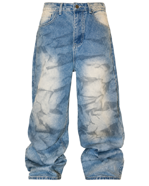 Faded blue baggy jeans with light-wash blotches and relaxed wide-leg fit