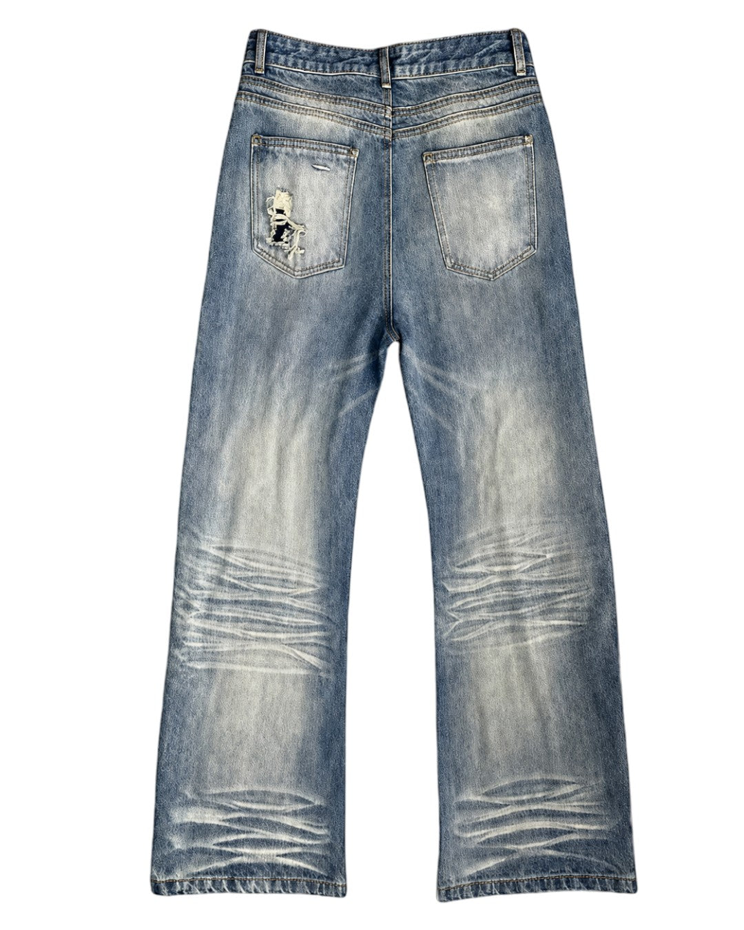 Light blue denim jeans with a heavily distressed and faded wash, featuring a ripped detail on the back right pocket, shown against a plain white background.