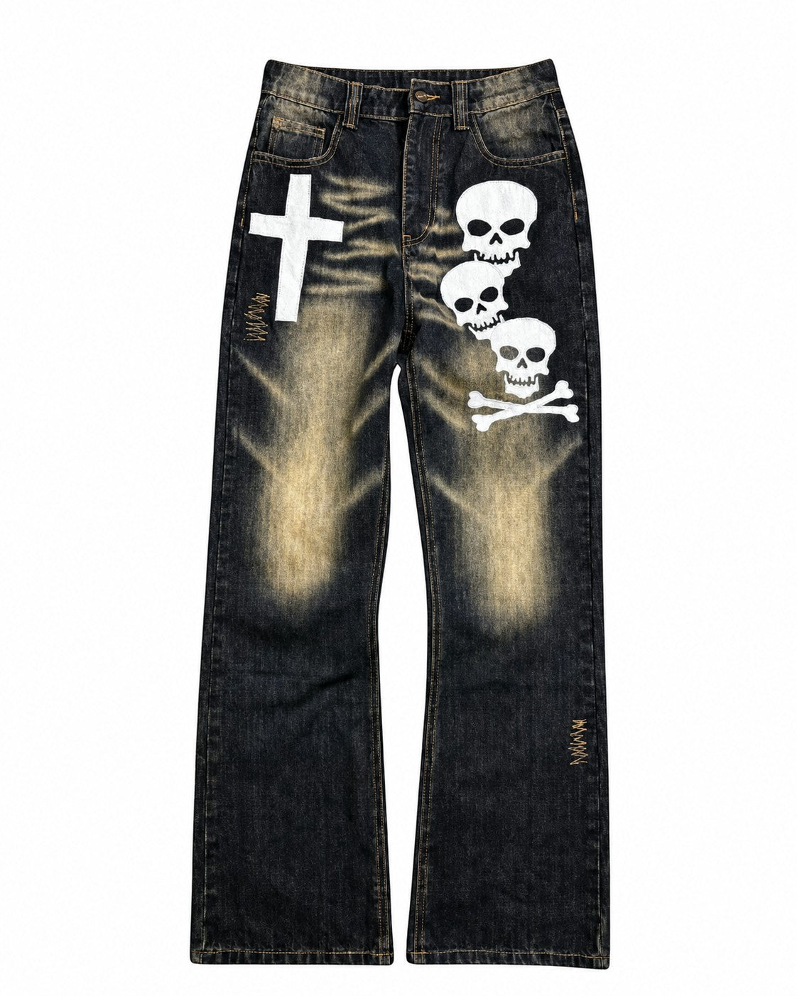 Black acid-wash denim jeans featuring a white cross graphic on the right thigh, a vertical stack of three white skulls with a skull-and-crossbones motif on the left thigh, and small gold 'MOKO' embroidery near the lower right leg.