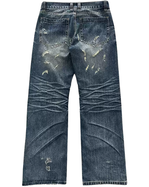 Distressed swag blue jeans on a white background