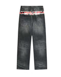 Black wide-leg jeans with faded front wash and red patch at waistband
